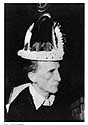 Duchamp in 1957, wearing a crown.